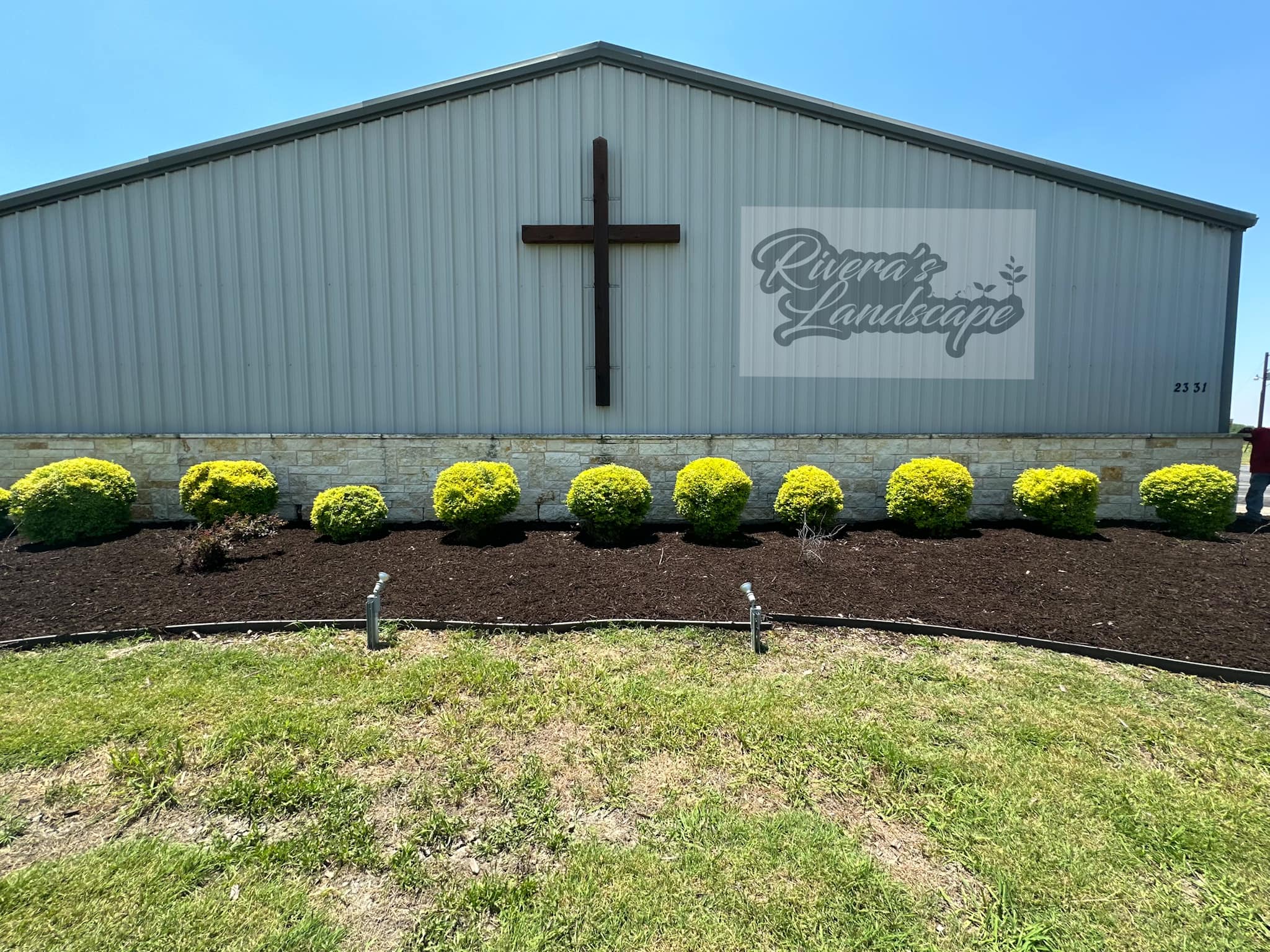 Fresh mulch and vibrant new plantings in The Colony.